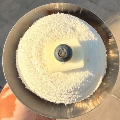 Coconut snowball dessert served in a coupe